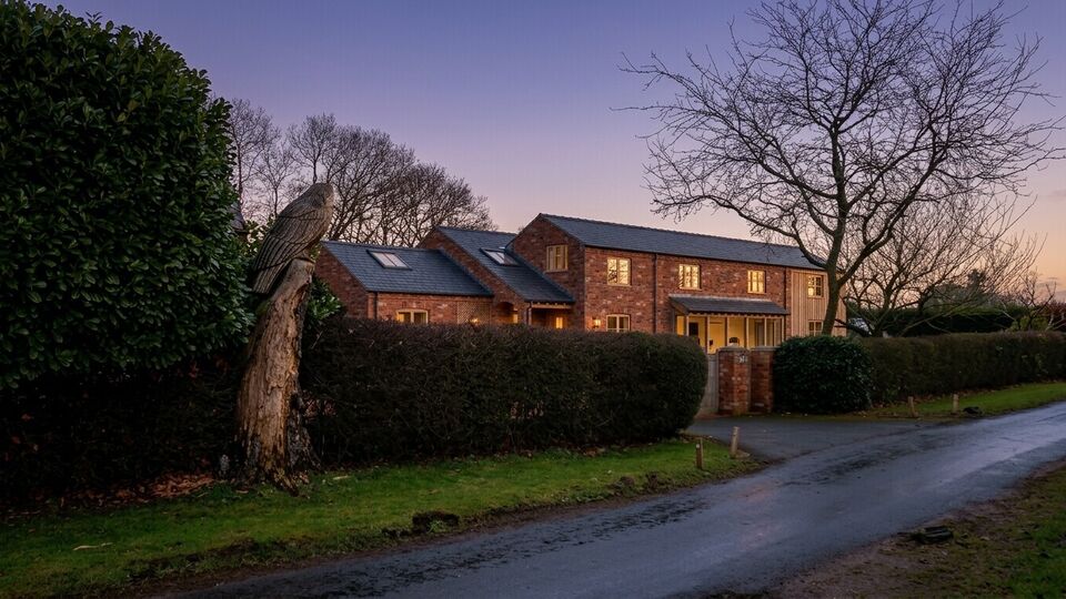 Luxury extension to Cheshire Cottage featuring floor-to-ceiling, porch and boot room in Cheshire brick, 2-storey timber-clad extension, Crittall windows and doors
